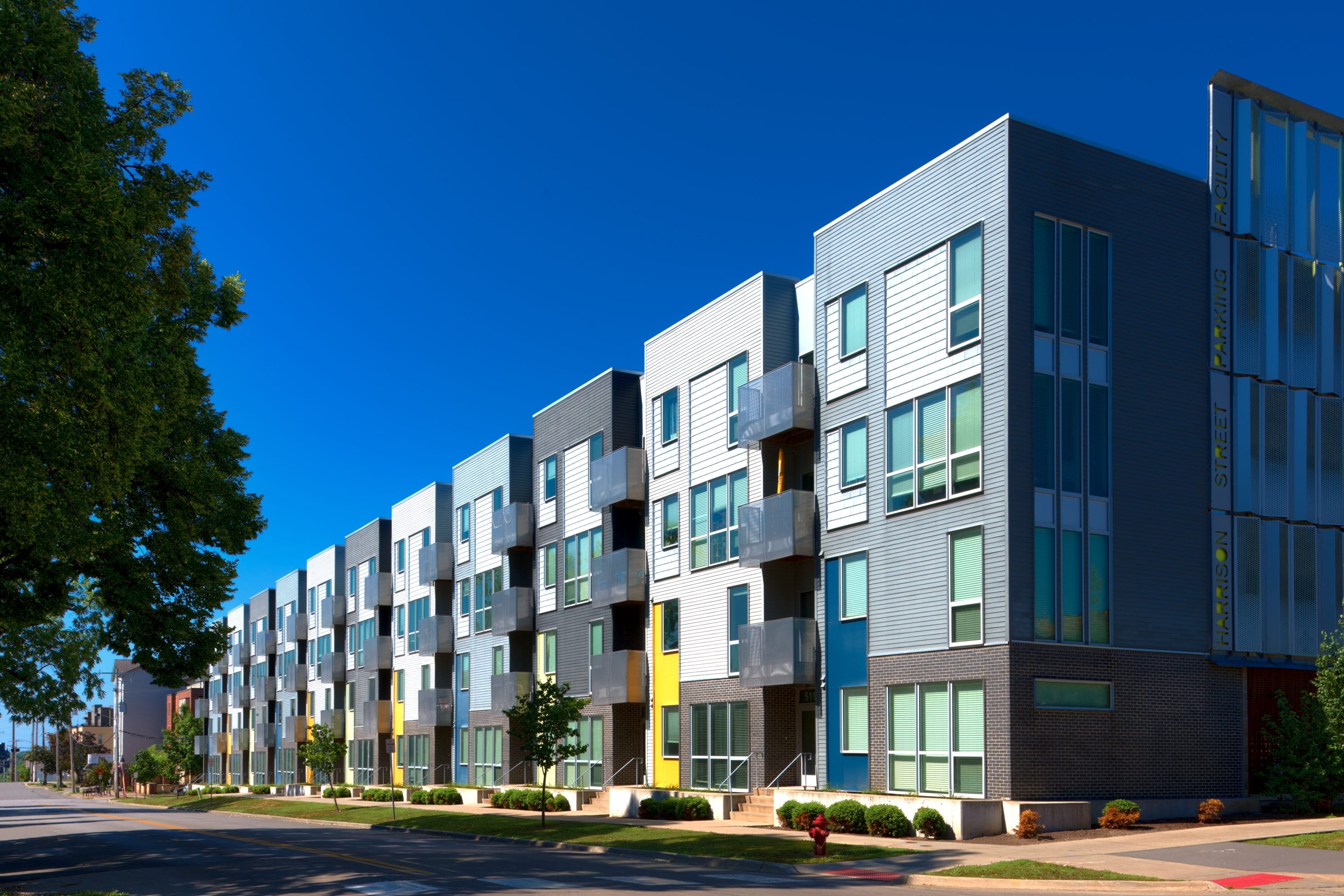 Stock image of a row of living complexes where commercial radon testing is helpful.